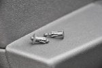 10 Plastic rivets-1 disengaged 1 ready to insert.jpg